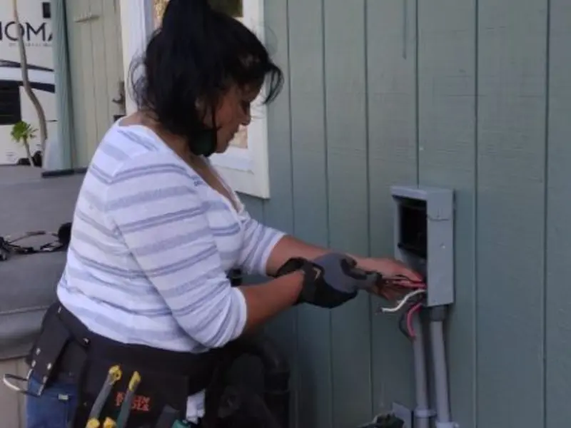 Licensed electrician wiring an exterior subpanel in Flemington